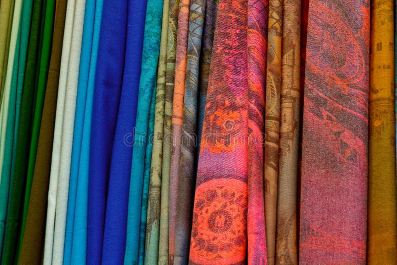 Blurry, not sharp sharpness Texture, background, pattern. Silk fabric is transparent, yellow-pink green in blue. Abstract soft chiffon texture background.