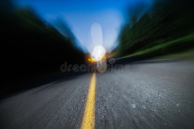 Blurry Road at Night. Drunk Driving, Speeding or Being too Tired