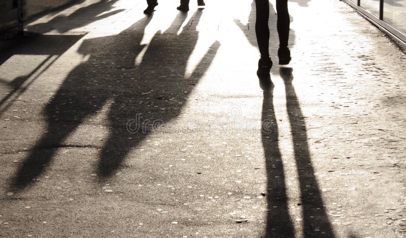 Blurry Shadows and Silhouettes on City Sidewalk Stock Photo - Image of ...