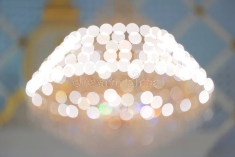 Blurry yellow rainbow chandelier and bokeh for luxury or happy holiday background. christmas, new year, birthday, anniversary stock images Blurry yellow rainbow chandelier and bokeh for luxury or happy holiday background. christmas, new year, birthday, anniversary stock images