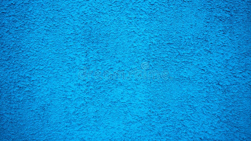Blue wall stucco vintage style background. Painted surface, an old concrete building in the city. Blue wall stucco vintage style background. Painted surface, an old concrete building in the city.