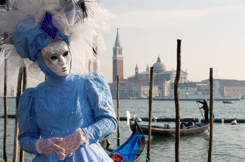 Blue mask from venice carnicval and san girogio church and lagoon. Blue mask from venice carnicval and san girogio church and lagoon