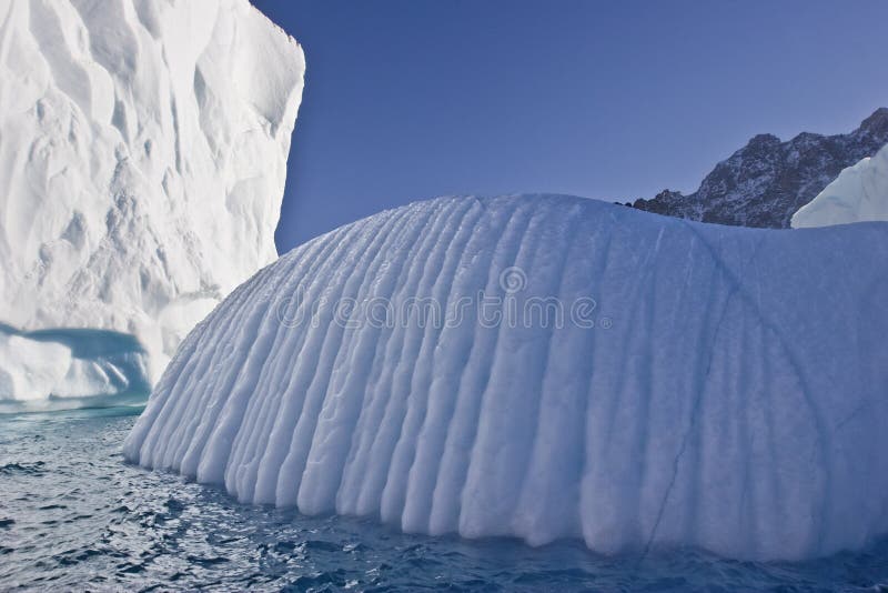 Giant icebergs floating in east greenland. Giant icebergs floating in east greenland