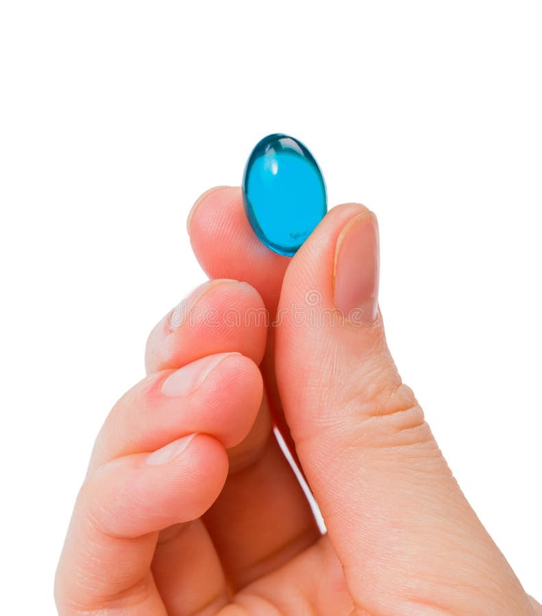 Closeup photo of blue gel capsule in hand. Closeup photo of blue gel capsule in hand