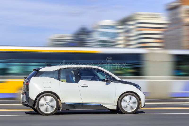 BEIJING-OCTOBER 28, 2016. BMW i3 electric car downtown. Researchers and trend watchers predict that electric cars will account for two thirds of the cars on the roads of 50 major world cities by 2030. BEIJING-OCTOBER 28, 2016. BMW i3 electric car downtown. Researchers and trend watchers predict that electric cars will account for two thirds of the cars on the roads of 50 major world cities by 2030.