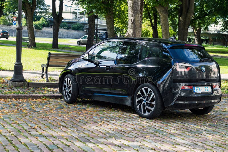 BMW i3 parked on a paved street. Black BMW electric car. Riga, Latvia - August 15, 2021.