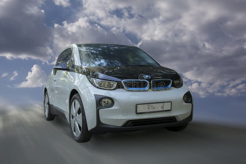 BMW i3 white electric car on blurred background. BMW i3 white electric car on blurred background.