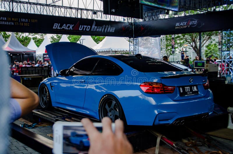 Surakarta Indonesia September 3 2016 M4 is the high performance version of BMW 4 series. Powered by six cylinders turbocharger engine that produced 414 horsepower and it exclusively available in two doors coupe and cabriolet. Surakarta Indonesia September 3 2016 M4 is the high performance version of BMW 4 series. Powered by six cylinders turbocharger engine that produced 414 horsepower and it exclusively available in two doors coupe and cabriolet