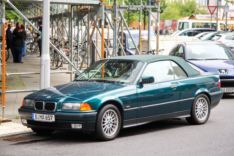 BMW 3-series. Berlin, Germany - September 12, 2013: Convertible motor car BMW 3-series E36 in the city street royalty free stock photo