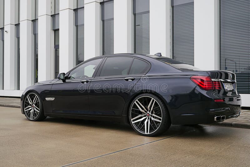 BMW 7 Series F01 Car Is Parked Near Office Building