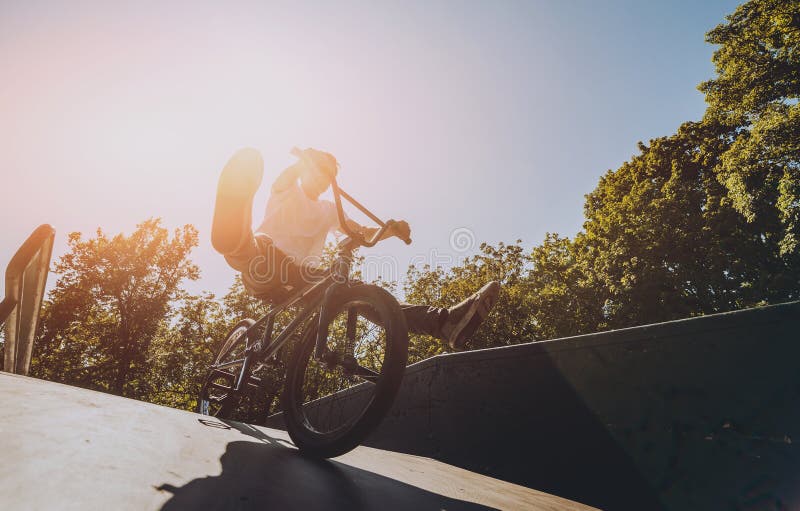 Bmx Rider Performing Tricks at Skatepark. Background. Stock Image