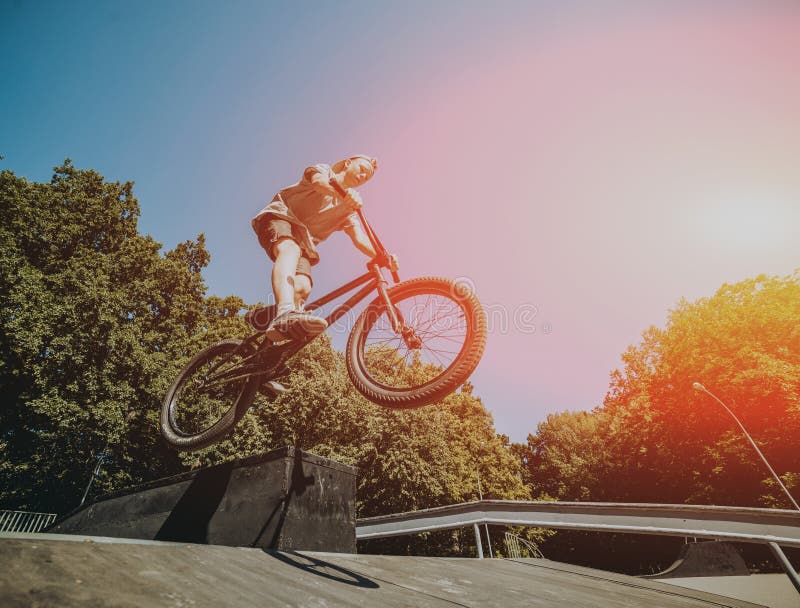 Bmx Rider Performing Tricks at Skatepark. Outdoors. Stock Image Image