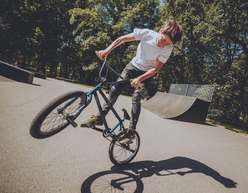 Bmx Rider Performing Tricks at Skatepark. Background. Stock Image