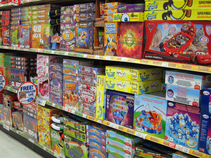 Various board games in boxes for sale in a toy store. This display is in the Toys R Us shop in Kempston, England, United Kingdom. Various board games in boxes for sale in a toy store. This display is in the Toys R Us shop in Kempston, England, United Kingdom.