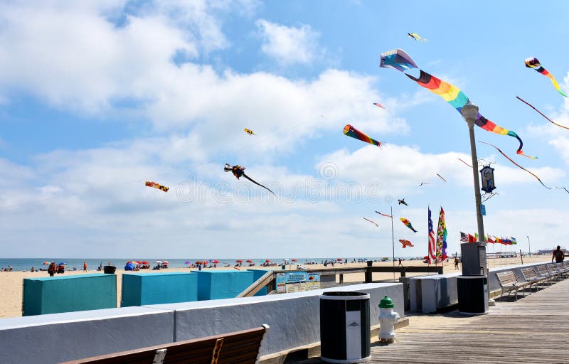 Boardwalk and Beach, Ocean City, Maryland. Flags and kites on the beach in Ocean City, Maryland, USA royalty free stock photography Boardwalk and Beach, Ocean City, Maryland. Flags and kites on the beach in Ocean City, Maryland, USA royalty free stock photography