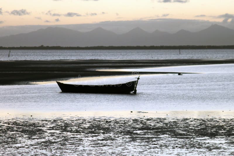 A boat on the beach and montains. A fishingboat in the beach and montains at Ilha do Mel , in Paranaguá, Paraná, Brazil stock photos A boat on the beach and montains. A fishingboat in the beach and montains at Ilha do Mel , in Paranaguá, Paraná, Brazil stock photos