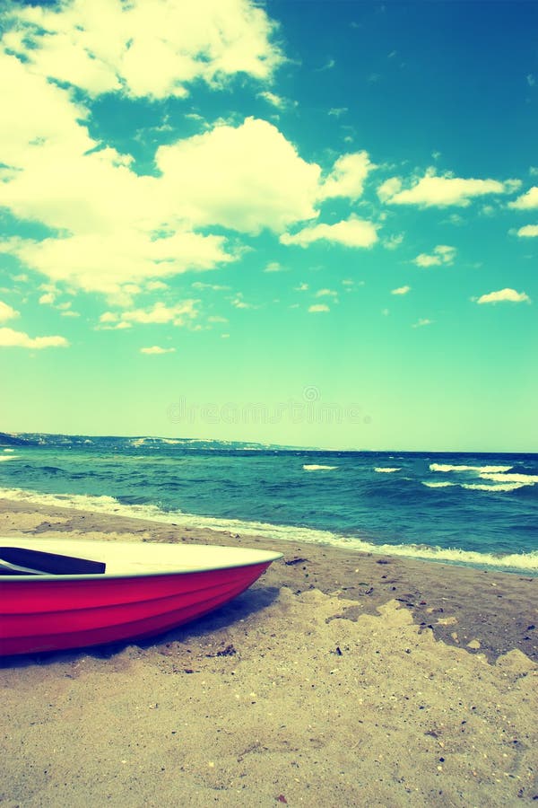 boat on the beach.vintage beach background stock photo