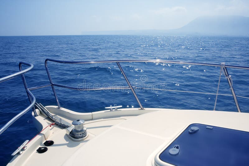 Boat bow sailing sea with anchor chain winch