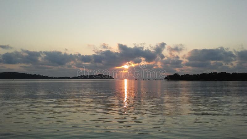 Boat in front of Ko Na Thian and Ko Mat Lang Islands during Sunrise on Koh Samui Island, Thailand.