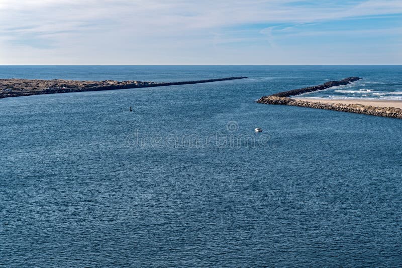 A Boat Going through the Jetty at Newport, Oregon, USA Stock Photo