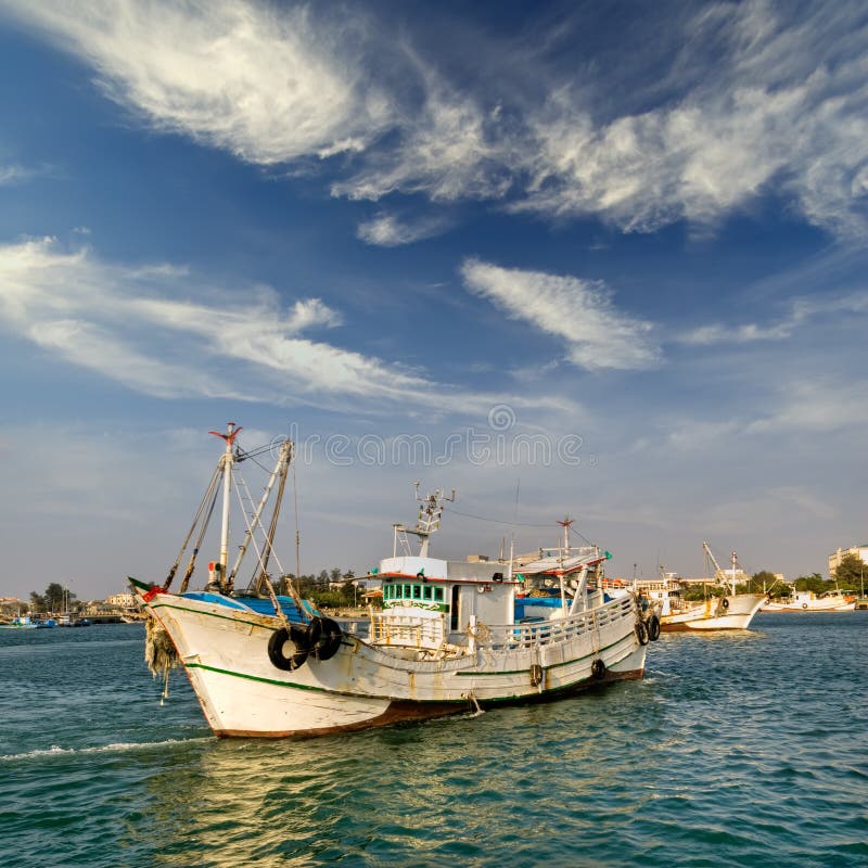Boat in harbor stock photography
