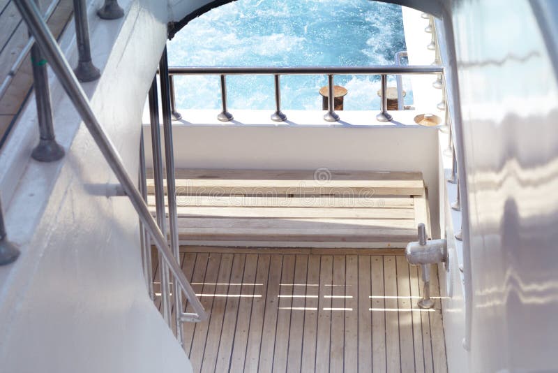Boat ladder, Deck on the stern of the yacht on a sunny day and beautiful bl...