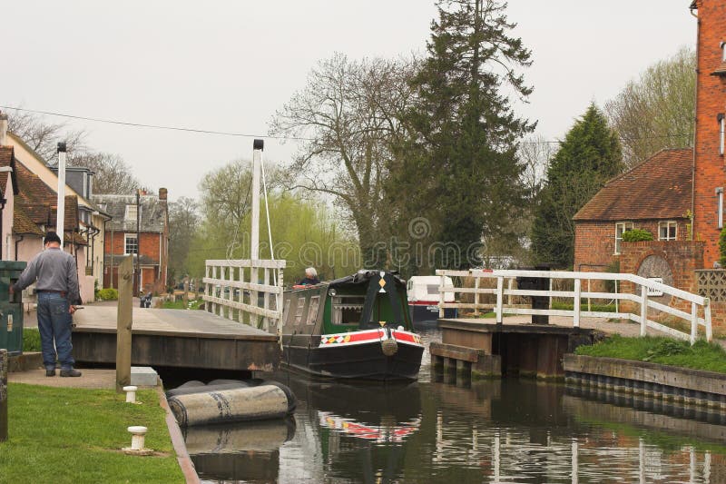 Boat motoring through canal lock