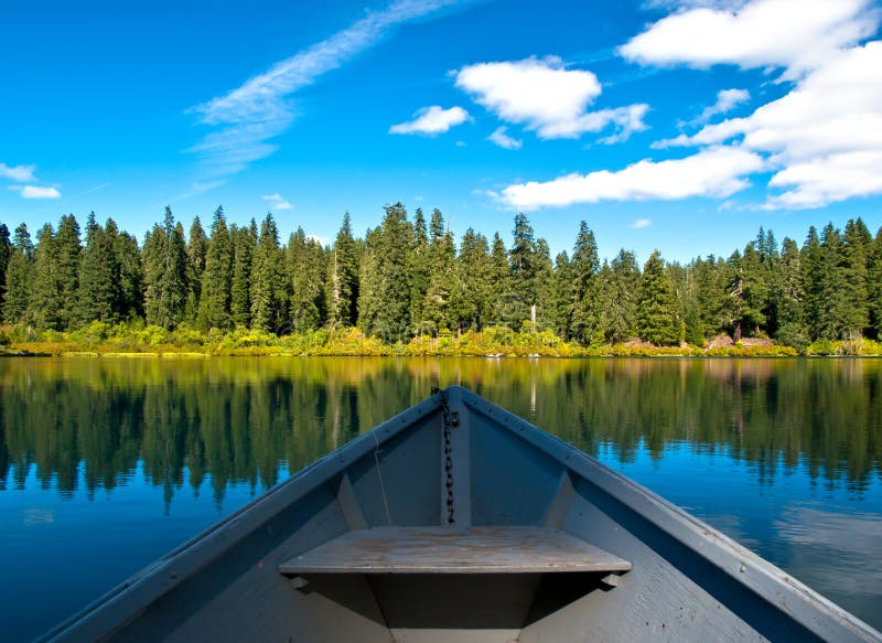 Boat on Mountain lake in forest stock image