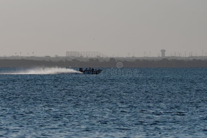 Boat Moving Swiftly Across a Lake with a Rooster Tail Behind it Stock Photo  - Image of outdoors, boating: 192305242