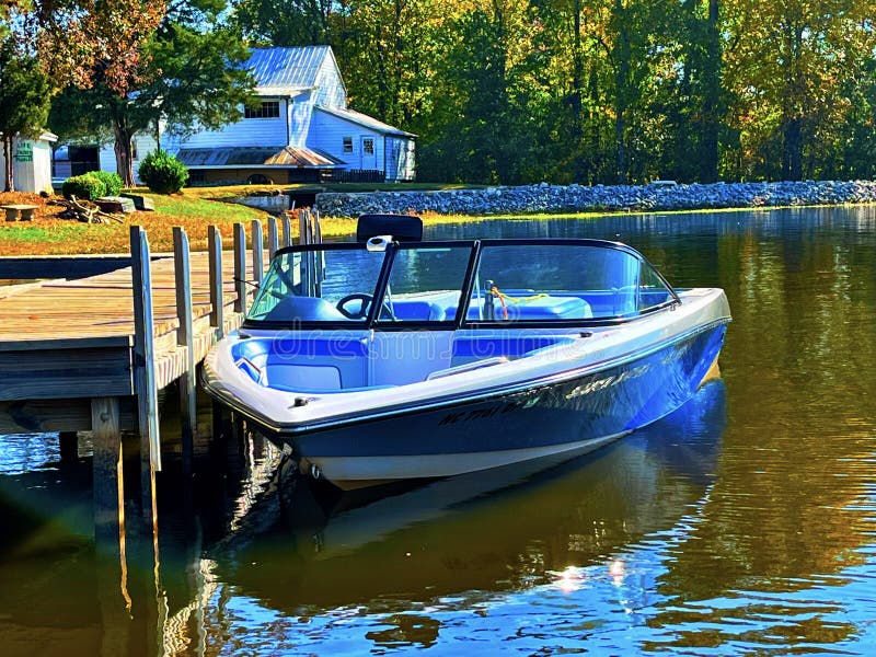 Boat near a dock stock image. Image of water, lake, pier 259872973