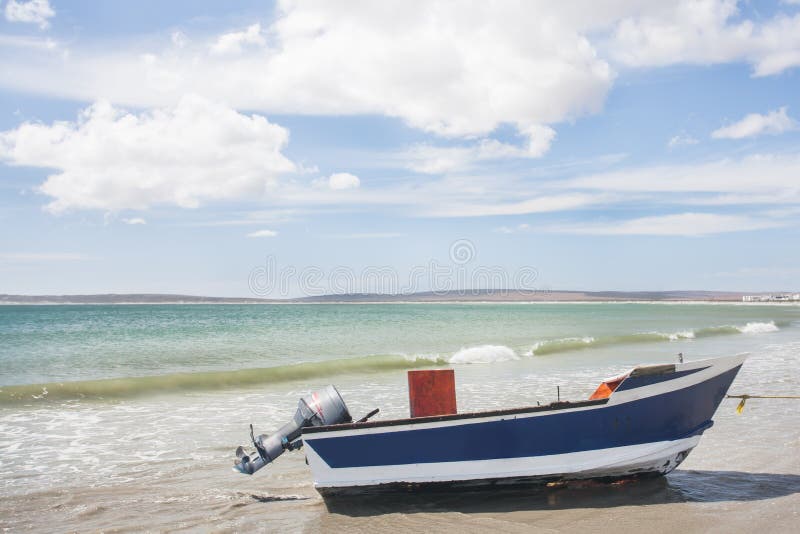 A boat with power motor out of water.