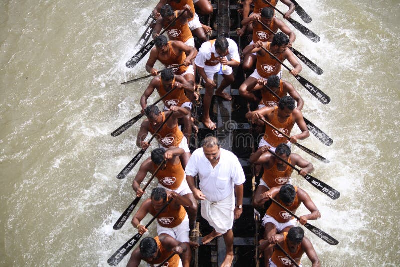 Oarsmen in a snake boat team actively participate in the Kottayam Boat race in Kerala, India. Oarsmen in a snake boat team actively participate in the Kottayam Boat race in Kerala, India