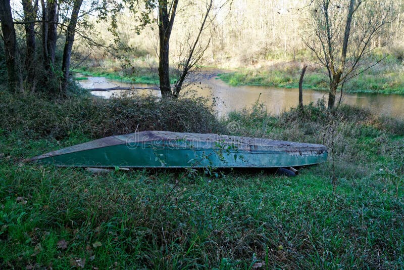 Boat in the Reeds on River Bank in Forest Stock Image - Image of beach ...