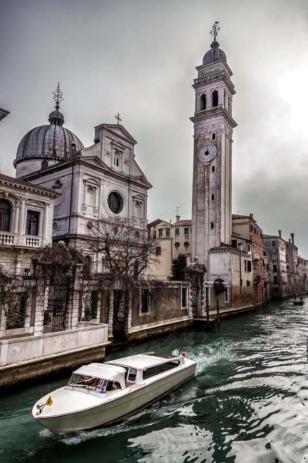 Boat in Rio del Greci near the campanile of church San Giorgio dei Greci, Venice, Italy