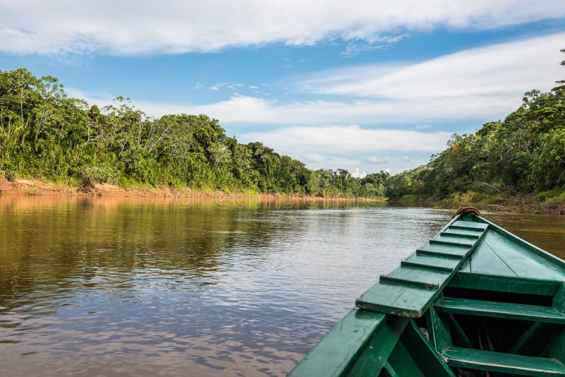 Boat in the river in the peruvian Amazon jungle at Madre de Dios Peru royalty free stock photo