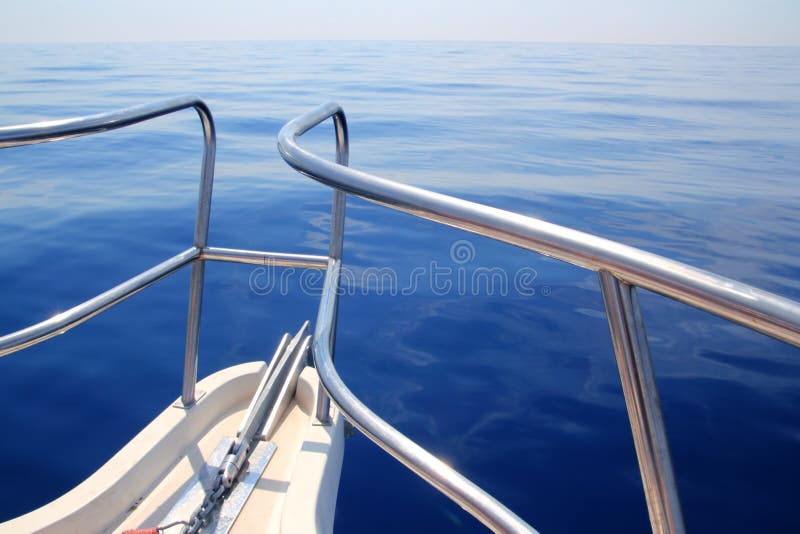 Boat sailing blue calm ocean sea bow railing stock photography