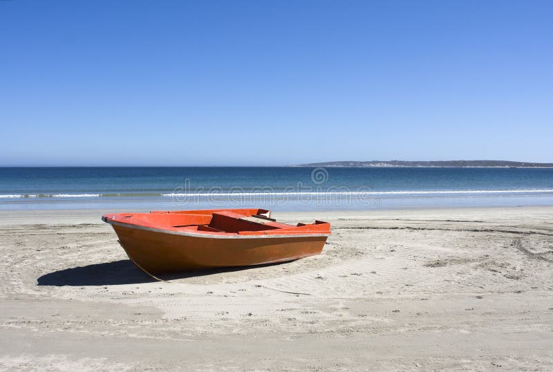 Boat on a secluded beach in Paternoster, South Africa on a sunny day. Boat on a secluded beach in Paternoster, South Africa on a sunny day