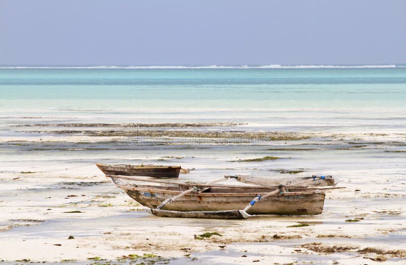 Boat sitting on a sea bottom while low tide