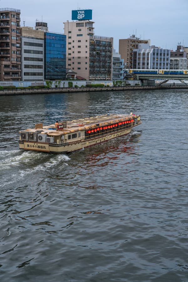 Sumida-ku, Tokyo - July 28, 2017: A boat in Sumida river and Yanagi-bashi bridge from Ryogoku-bashi Bridge