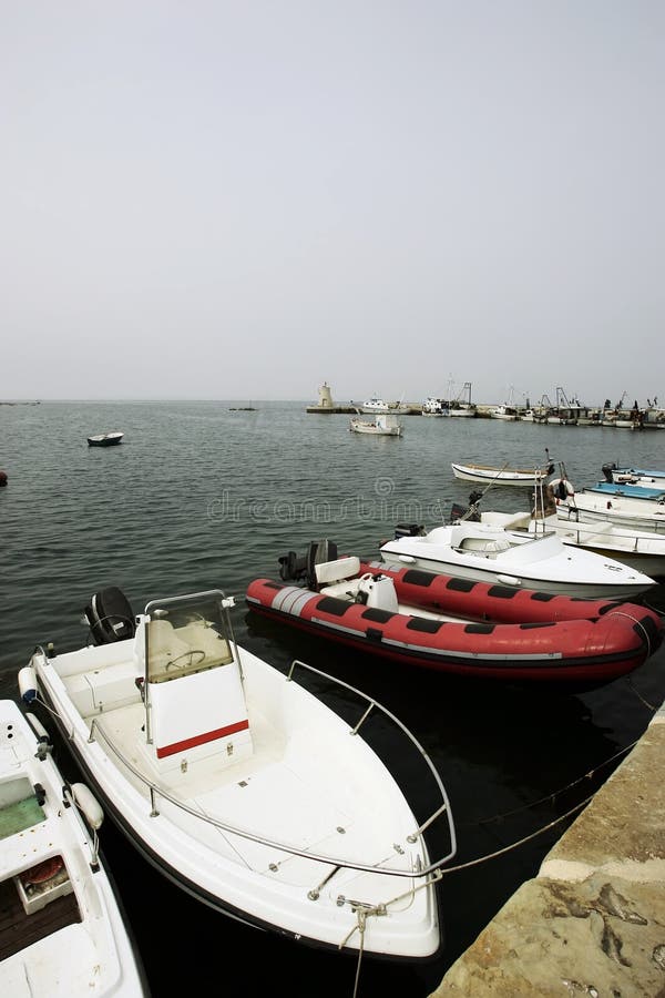 Boats lies peacefully in some European dock