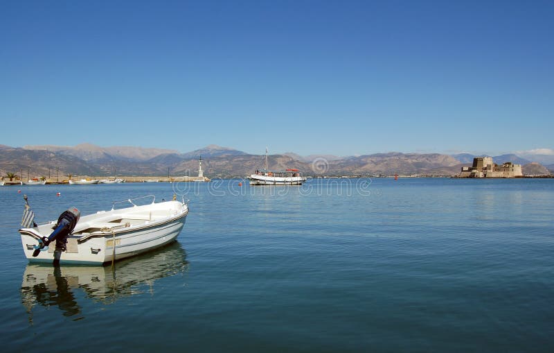 Boats on calm sea and castle