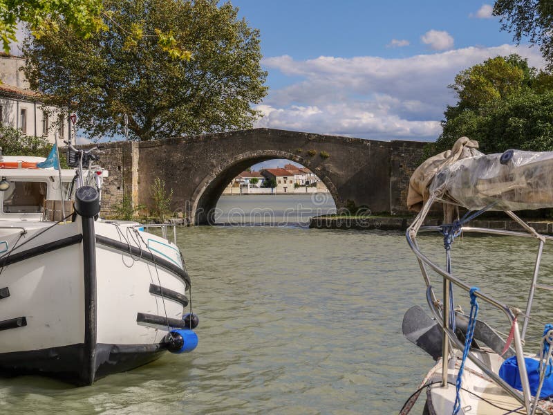 Boats on the canal at Castelnaudary in the Aude Department in the Languedoc Roussillon region of the South of France and a major French tourist destination. Boats on the canal at Castelnaudary in the Aude Department in the Languedoc Roussillon region of the South of France and a major French tourist destination.