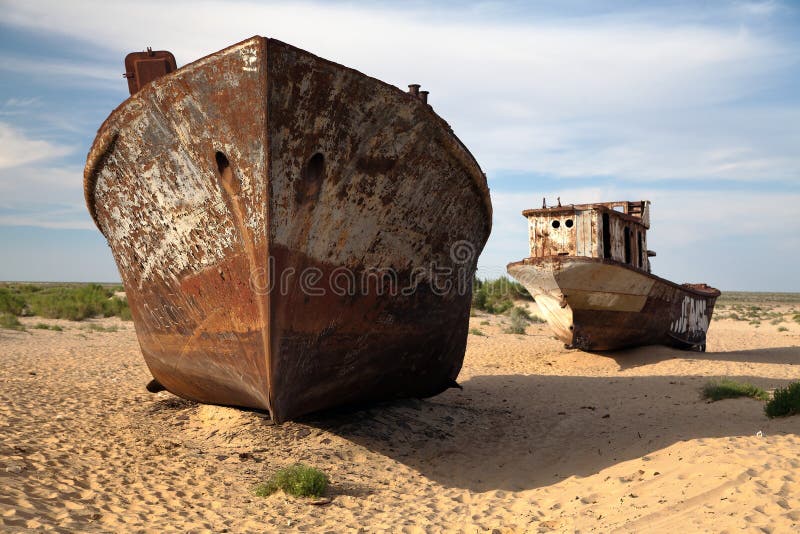 Boats in desert around Moynaq - Aral sea or Aral lake - Uzbekistan