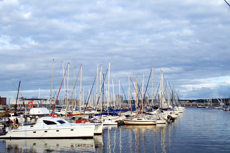 Boats docked at harbor royalty free stock image