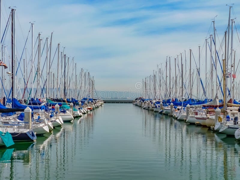 Boats at San Francisco South Beach Yacht Club with Their Reflect Stock
