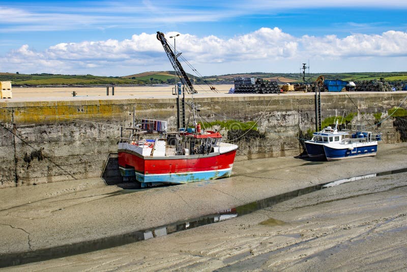 Boats in the Harbour at Low Tide in Padstow Cornwall Stock Image