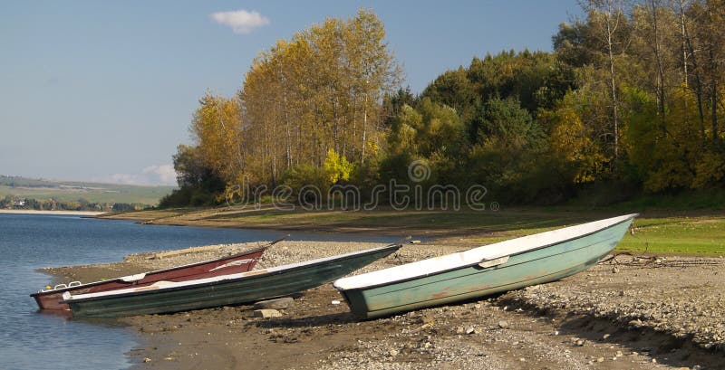 Boats moored on lake