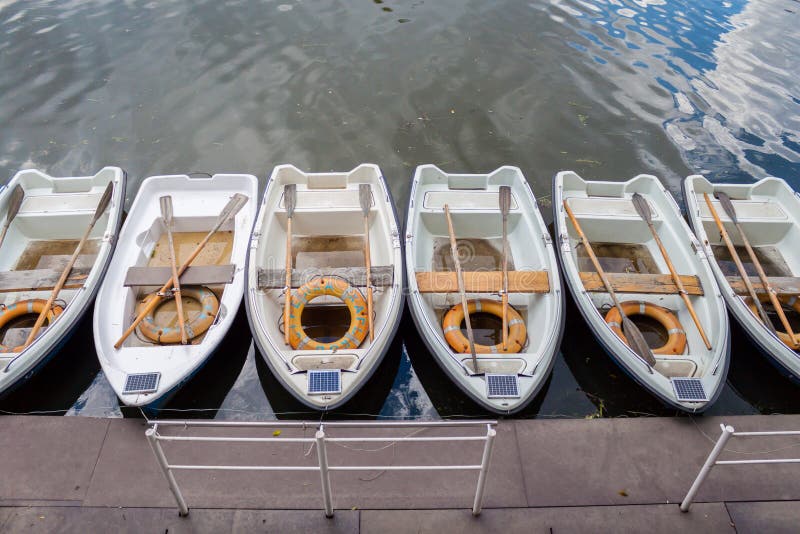 Boats near the pier standing in line