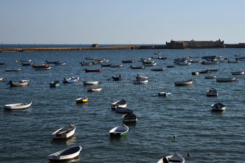Boats off the Atlantic coast near the fortress of San Sebastian in Cadiz. royalty free stock photos Boats off the Atlantic coast near the fortress of San Sebastian in Cadiz. royalty free stock photos