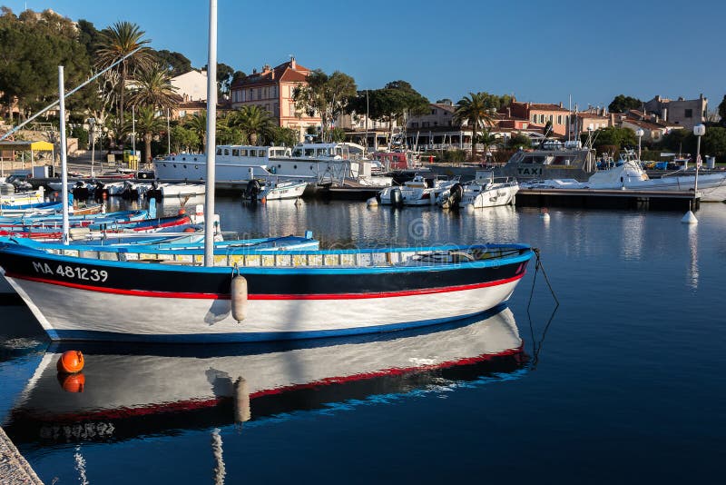 Boats in port of Porquerolles in Provence by a spring evening